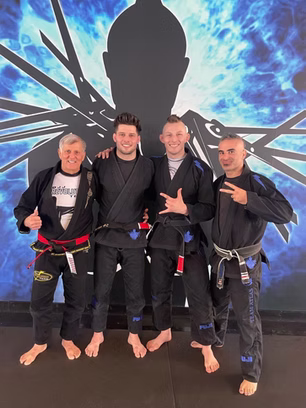 Black belts posing in BJJ gis