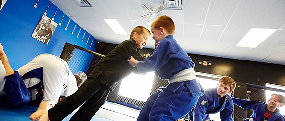 Two young children sparring