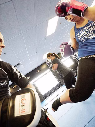 Woman training in BJJ gym