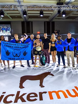 Atlas team posing for photo at MMA championship