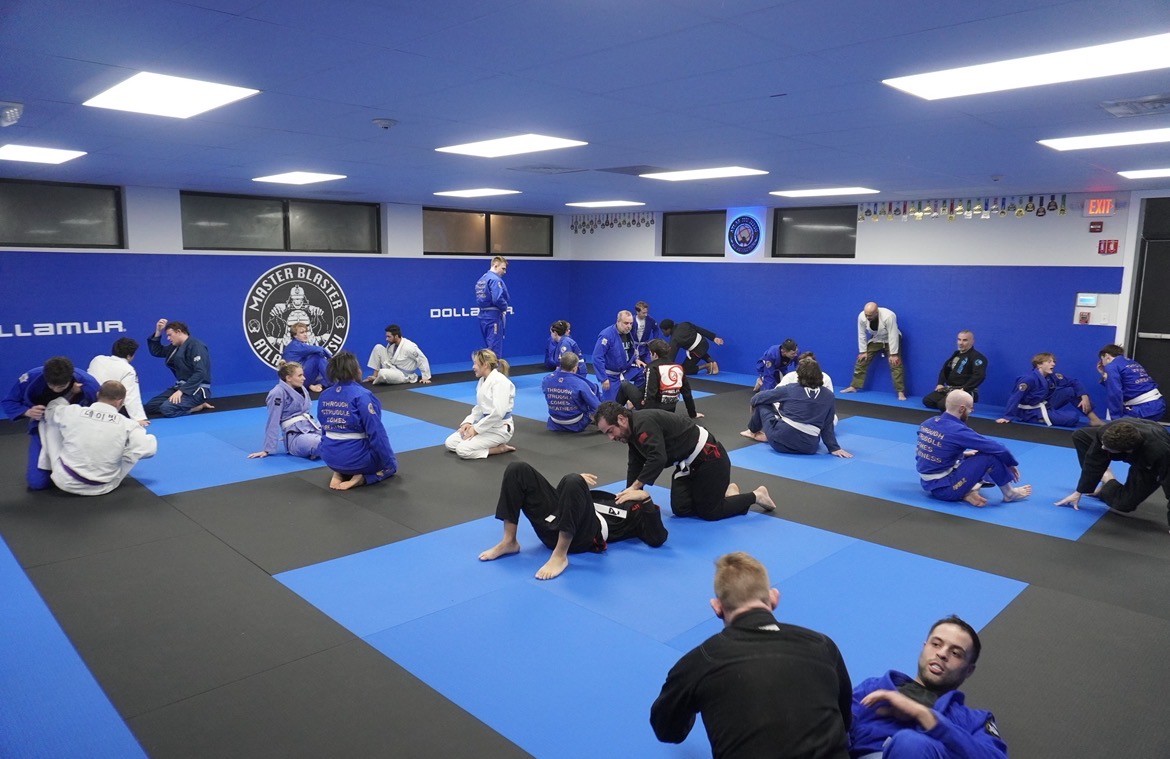 in-progress BJJ class in Atlas Jiu Jitsu's Waltham, MA gym