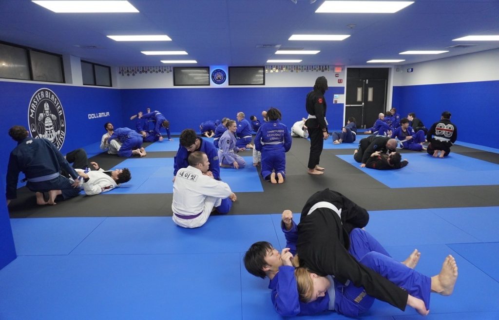 in-progress BJJ class in Atlas Jiu Jitsu's Waltham, MA gym